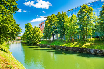 Green banks of Ljubljanica river in city of Ljubljana, Slovenia