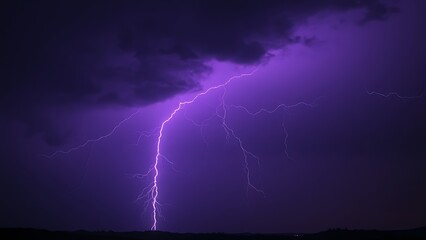 Dramatic purple lightning illuminating a stormy night sky, capturing raw natural energy.