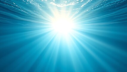 Obraz premium Sunlight streams through ocean waves, creating a mesmerizing play of light and shadow in deep blue waters.