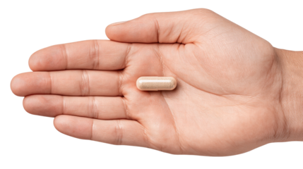 Hand holding single capsule pill isolated transparent background with clear details and texture