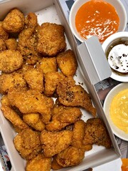 Crispy Korean fried chicken, perfectly glazed with a sweet and spicy sauce. Ideal for food photography and menus, showcasing the irresistible crunch and flavor of this beloved dish.