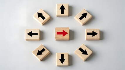 Wooden blocks with arrows pointing in different directions