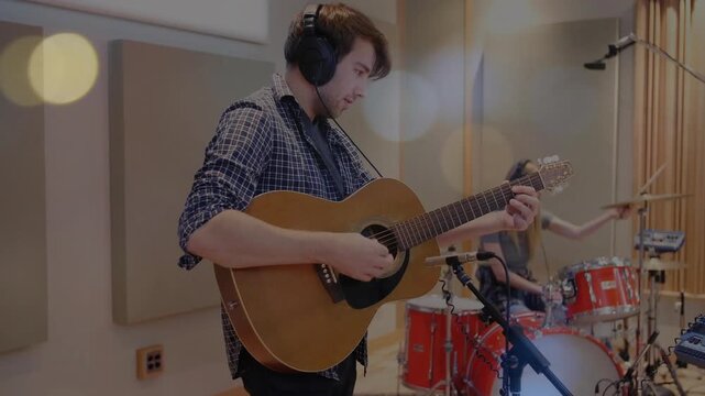 Guitarist strumming chords starting animated music notes as drummer hitting drums rehearsing