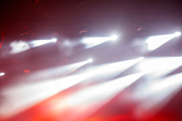 A series of lights are shining on a red background