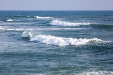 The ocean is calm and the waves are small