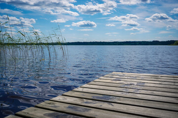 Beautiful lake view with wooden pier on the lake