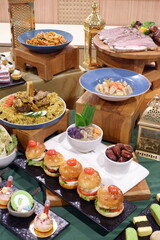 A close-up shot of a prepared table full of yummy meals for a party. buffet catering food...