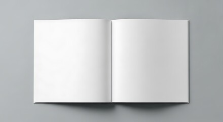 Open blank book with white pages on a grey background, ready for content
