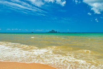 Thailand - Krabi - Ao Nang Beach July 27th 2025. This was on a beautiful morning during the wet season. The Andaman sea during the low season surrounded by beautiful mountains.
