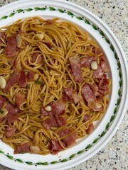 Classic spaghetti coated in rich tomato sauce, offering a simple yet delicious combination of...