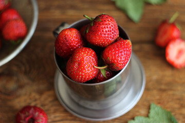 Strawberries in a metal bucket