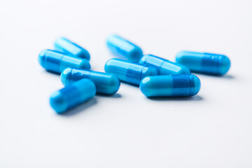 Amino acids capsules on bright background. Soft focus. Close up. Copy space.	