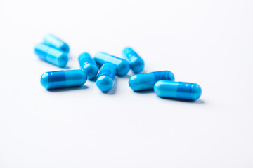 Amino acids capsules on bright background. Soft focus. Close up. Copy space.	