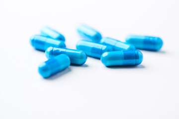 Amino acids capsules on bright background. Soft focus. Close up. Copy space.	