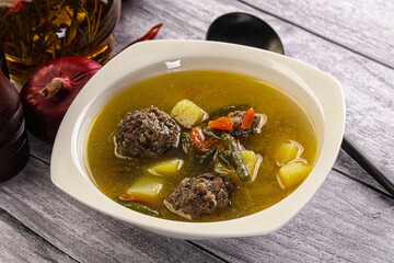 Soup with beef meatballs and vegetables