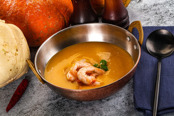 Pumpkin cream soup with prawns
