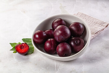 Raw ripe purple plum heap