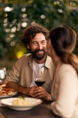 Romantic Couple Enjoying Dinner and Conversation at an Intimate Cozy Setting