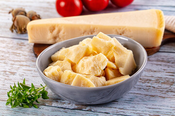 Parmesan cheese pieces in the bowl