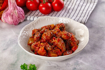 Roasted chicken hearts with vegetables