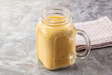 Sweet mango smoothie dessert glass