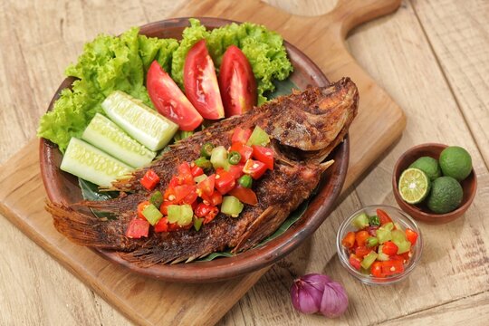 Ikan Nila Bakar. Grilled tilapia with dabu-dabu chili sauce