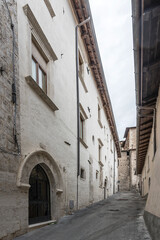 historical buildings on uphill lane, L'Aquila, Italy