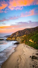 Coastal sunset scene with sandy beach, waves, and cliffs