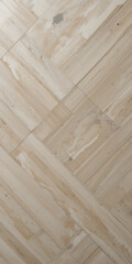 Herringbone patterned wood flooring with subtle pink and beige tones