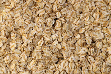 dry flakes made from oatmeal, a large amount of oat flakes for quick cooking of porridge, clos up