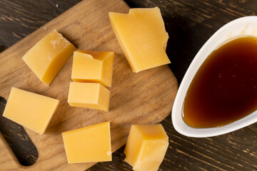 fresh yellow cheese and viscous sweet natural bee honey, sweet honey and sliced milk cheese