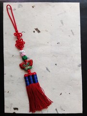 Traditional Korean handmade colorful knots with butterfly embroidered decoration and a piece of...