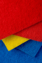 blue, red and yellow part of the fabric for washing dirt , glued and tightly intertwined synthetic...