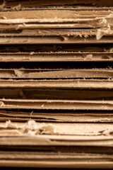 Multilayer cardboard for boxes close up, large amounts of corrugated cardboard after use in transportation