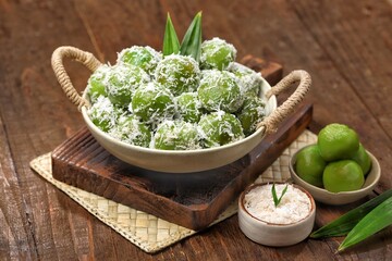 Klepon, also known as onde-onde, is a type of cake or steamed snack made from rolled sticky rice flour, filled with brown sugar and spread over grated coconut until it sticks.