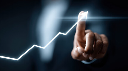 Businessman touching upward chart, symbolizing growth and success in professional setting