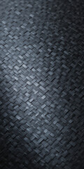 Woven dark texture diagonal view of interlaced rectangular fibers