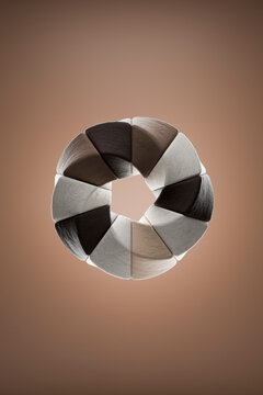 Abstract 3D geometric torus with pentagonal stone shapes on background
