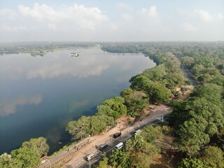 Camouflage colour bell 212 helicopter in hover over a large water tank and ready for departure	