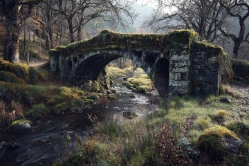 Misty, moss-covered stone bridge over a stream in a woodland