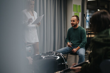 Musicians rehearsing in studio, preparing and collaborating for performance. Musical equipment and...