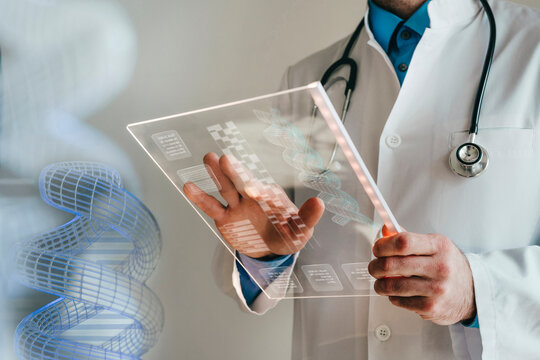 Scientist using transparent digital screen for genetic research in laboratory