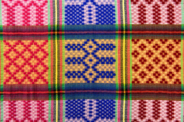 Traditional Colorful hand-woven fabrics texture background.