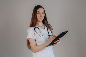 Notepad is in hand. Female doctor is in the studio