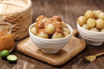 Cilok with spicy peanut sauce, a snack with a chewy and savory texture, with a spicy taste that burns the tongue