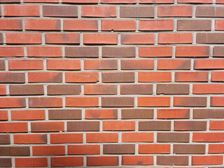 It's a wall made of red bricks.