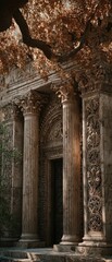 Naklejka premium Ornate stone entrance, columns, autumn leaves