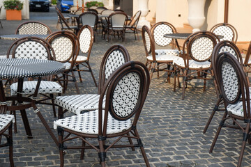 Classic white steel chair and table in the garden,empty white vintage chairs in the garden,decoration english garden concept.