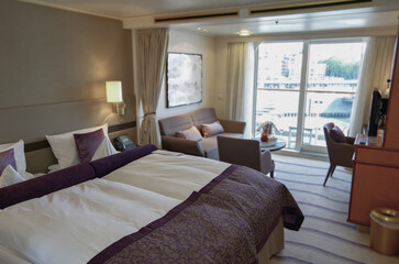 Luxurious suite stateroom cabin room onboard luxury yacht cruise ship cruiseship liner with bedroom...