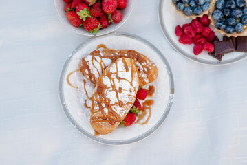 A bowl of fruit on a plate